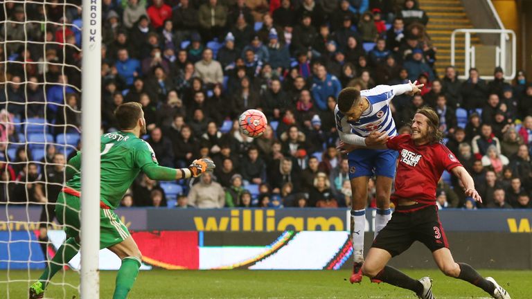 Michael Hector (C) of Reading heads the ball to score his team's second goal during the Emirates FA Cup fifth round match with West Brom