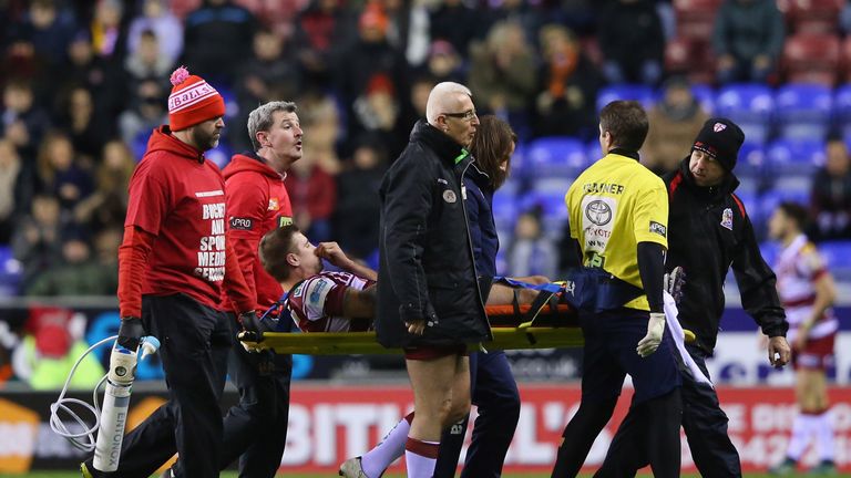 Michael McIlorum  is stretchered off injured during the World Club Series match between Wigan Warriors and 