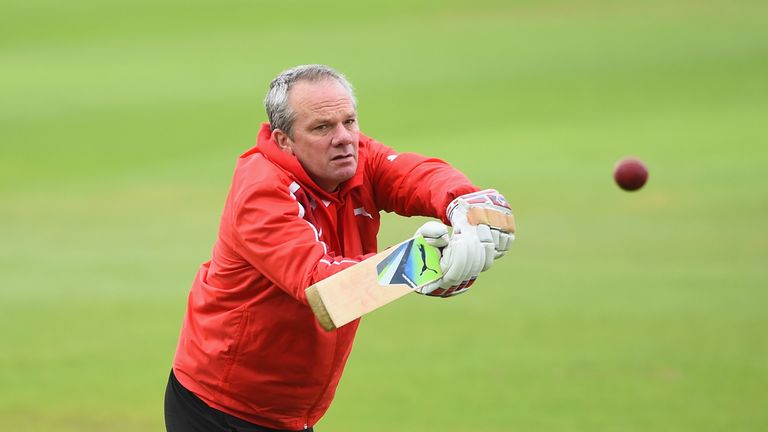 Mick Newell of Nottinghamshire warms up his players