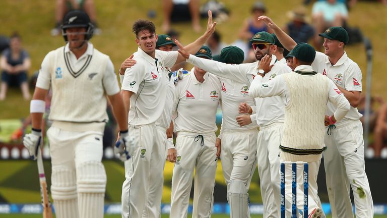 Mitch Marsh of Australia celebrates after taking the wicket of Corey Anderson of New Zealand