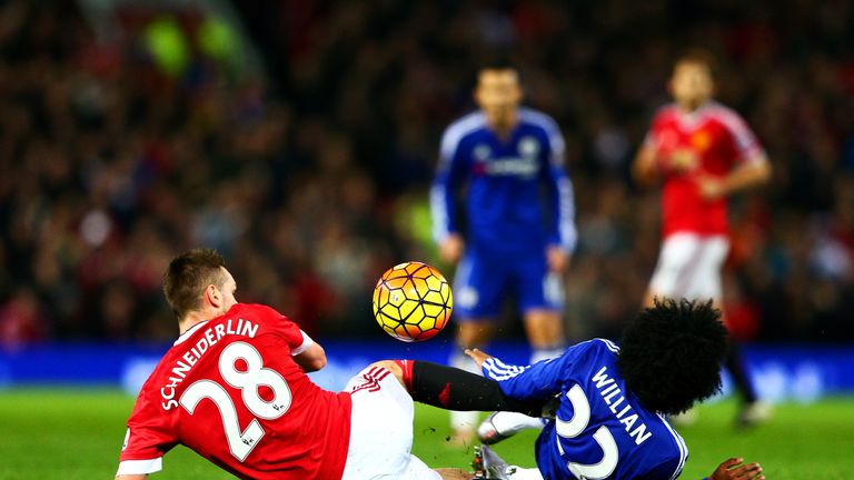 Morgan Schneiderlin of Manchester United fouls Willian of Chelsea during the Barclays Premier League match