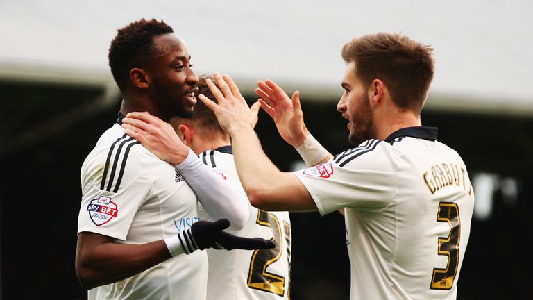 Moussa Dembele (L) of Fulham celebrates with Luke Garbutt (R) after Markus Olsson concedes an own goal during the Championship match v Derby County