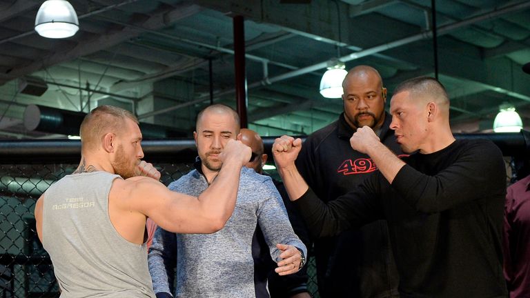 UFC featherweight champion Conor McGregor (L) and lightweight contender Nate Diaz (R) face off