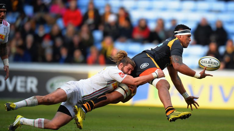 COVENTRY, ENGLAND - FEBRUARY 28:  Nathan Hughes of Wasps is tackled by Luke Wallace of  Harlequins during the Aviva Premiership match between Wasps and Har