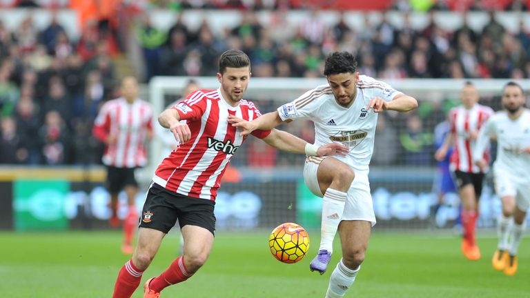 Swansea City's Neil Taylor (right) and Southampton's Shane Long battle for the ball