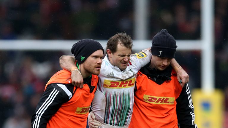 Nick Evans is helped off the pitch after being injured against Gloucester