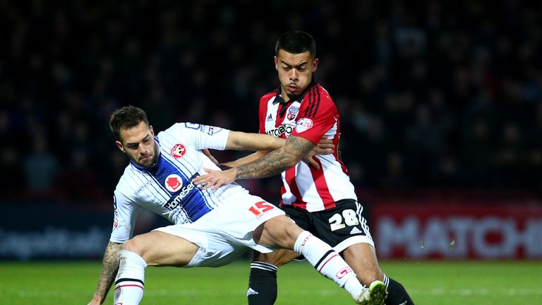 LONDON, ENGLAND - JANUARY 09:  Milan Lalkovic of Walsall tries to hold off Nico Yennaris of Brenford during the FA Cup Third Round match