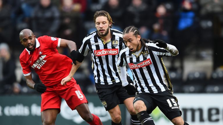 Curtis Thompson and Alan Smith of Notts County battle with Leyton Orient's Nigel Atangana