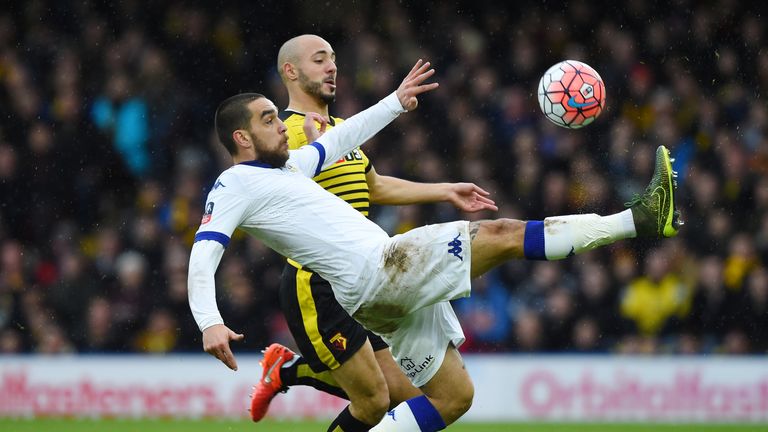 Giuseppe Bellusci of Leeds and Nordin Amrabat of Watford compete for the ball 