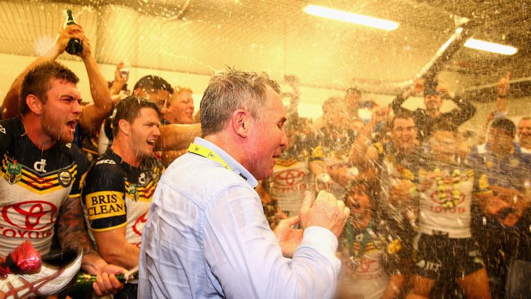 North Queensland Cowboys coach Paul Green is sprayed by his players with champagne after winning the 2015 NRL Grand Final 