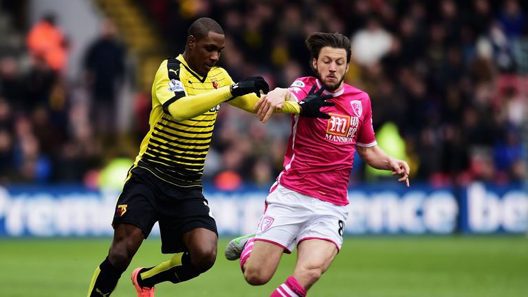 Odion Ighalo of Watford and Harry Arter of Bournemouth compete for the ball