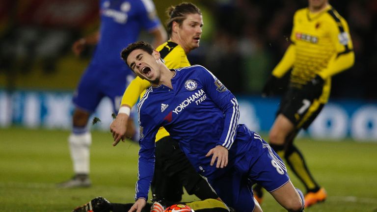 Chelsea's Oscar (front) is fouled by Watford's Sebastian Prodl (back)