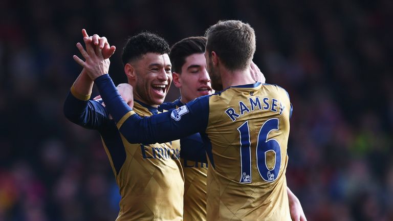 BOURNEMOUTH, ENGLAND - FEBRUARY 07:  Alex Oxlade-Chamberlain of Arsenal (L) celebrates with Hector Bellerin and Aaron Ramsey as he scores their second goal