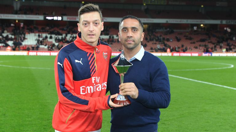 Mesut Ozil recieves the Arsenal Player Of The Month award before the Barclays Premier League match between Arsenal and Southampton at Emirates Stadium