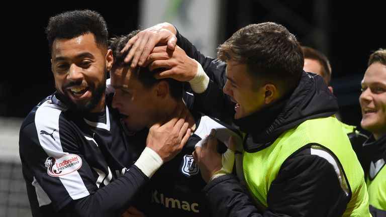 Dundee's Paul McGinn (centre) celebrates with Kane Hemmings (left) having opened the scoring 