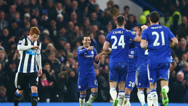 Pedro (2nd L) of Chelsea celebrates scoring his team's fourth goal 