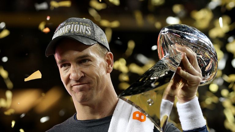  Peyton Manning #18 of the Denver Broncos celebrates with the Vince Lombardi Trophy 