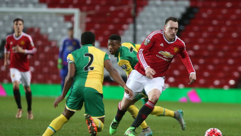 Phil Jones of Manchester United U21s in action with Reece Hall-Johnson of Norwich City U21s 