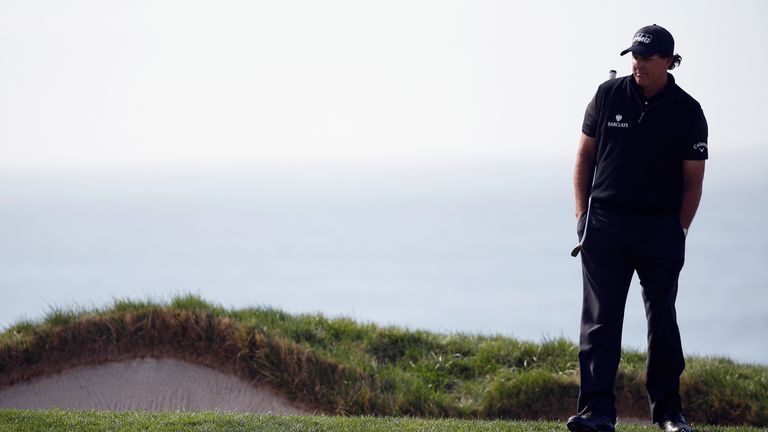 PEBBLE BEACH, CA - FEBRUARY 14:  Phil Mickelson waits to putt on the fourth green during the final round of the AT&T Pebble Beach National Pro-Am at the Pe