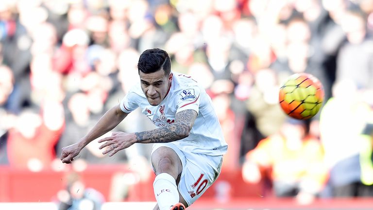 Philippe Coutinho of Liverpool takes a free-kick against Aston Villa