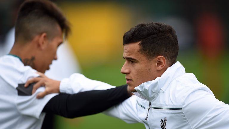 Coutinho (R) is at Liverpool alongside Brazilians Firmino (L) and Lucas Leiva