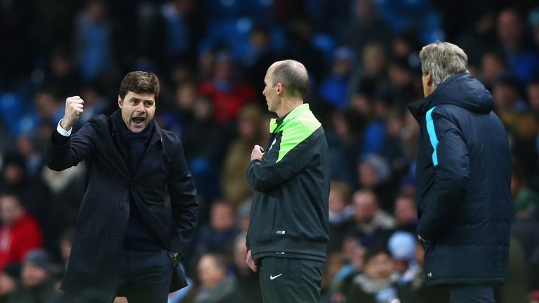 Mauricio Pochettino, Manager of Tottenham Hotspur celebrates victory with Manuel Pellegrini, Manager of Manchester City 