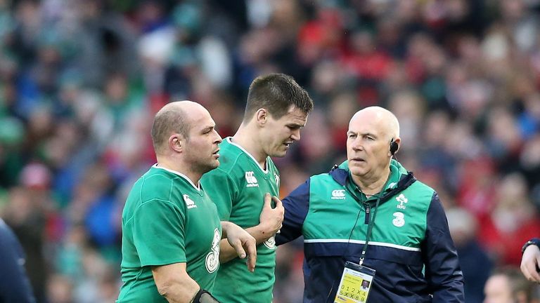 DUBLIN, IRELAND - FEBRUARY 07:  Injured flyhalf Jonathan Sexton (R) of Ireland is consoled by captain Rory Best as he leaves the pitch during the RBS Six N