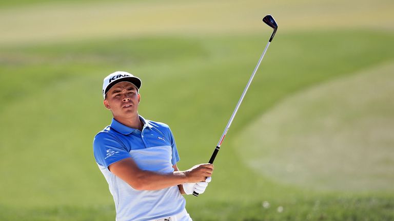 Rickie Fowler of the United States hits from a bunker on the sixth hole during the third round of the Honda Classic 