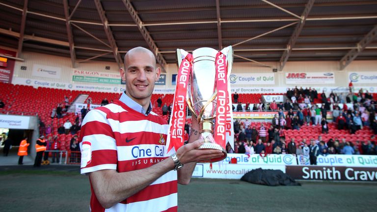 Doncaster Rovers' Rob Jones with League One trophy at the Keepmoat Stadium, Doncaster.