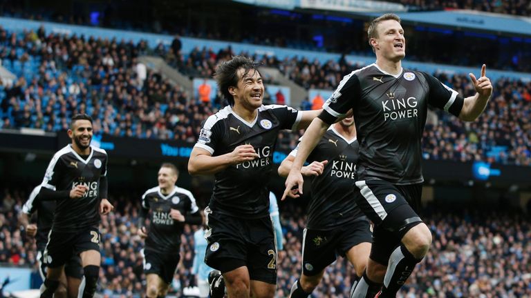 Leicester City's Robert Huth (R) celebrates scoring