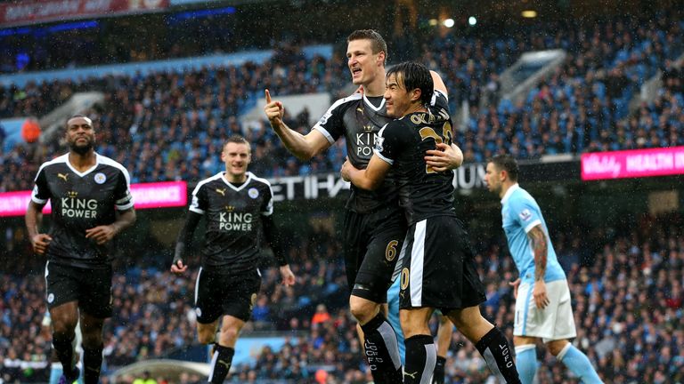 Robert Huth (3rd L) of Leicester City celebrates