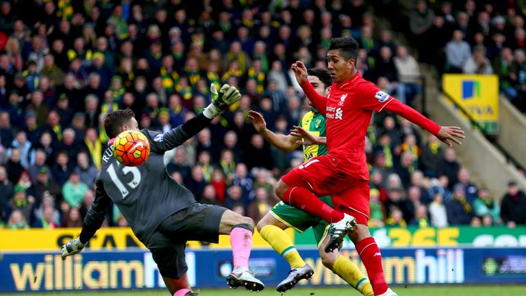 Roberto Firmino of Liverpool scores his team's third goal