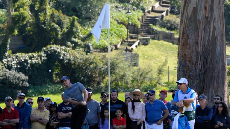 Rory McIlroy of Northern Ireland takes shot on the 11th hole during the final round of the Northern Trust Open