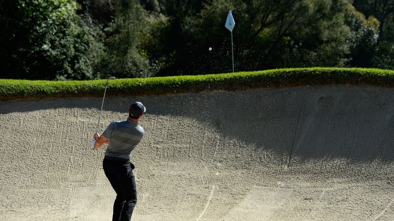 Rory McIlroy of Northern Ireland out of the bunker on the 12th hole during the final round of the Northern Trust Open at Riviera Country Club 