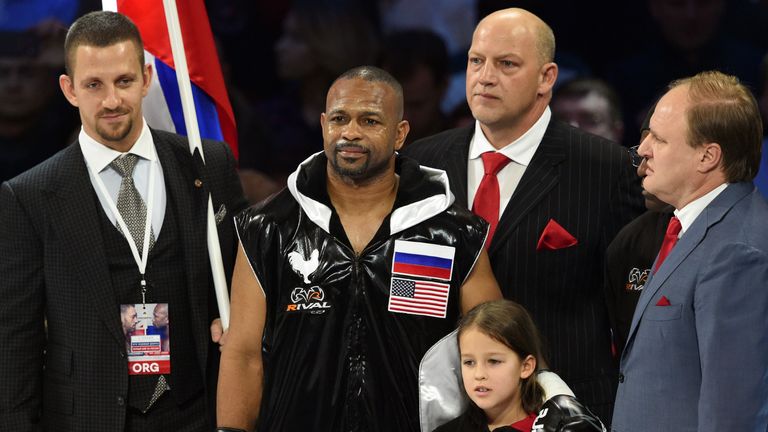 American-Russian boxer Roy Jones Jr. (2nd L) listens to the Russian anthem