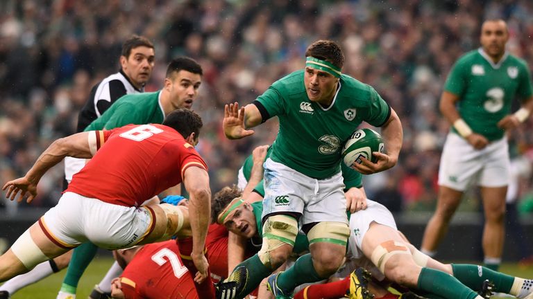CJ Stander of Ireland hands off Sam Warburton of Wales during the Six Nations drawn game