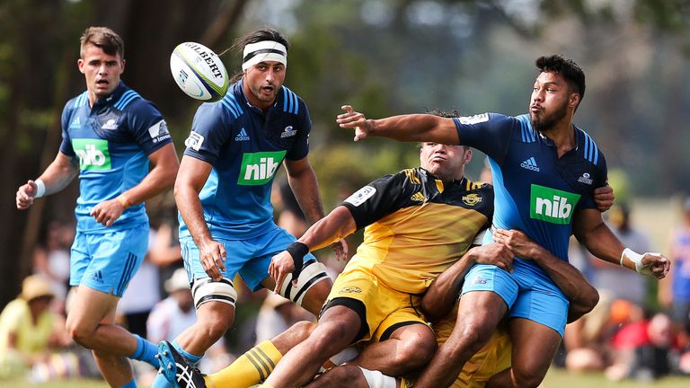 George Moala offloads during the Super Rugby pre-season match between the Blues and the Hurricanes