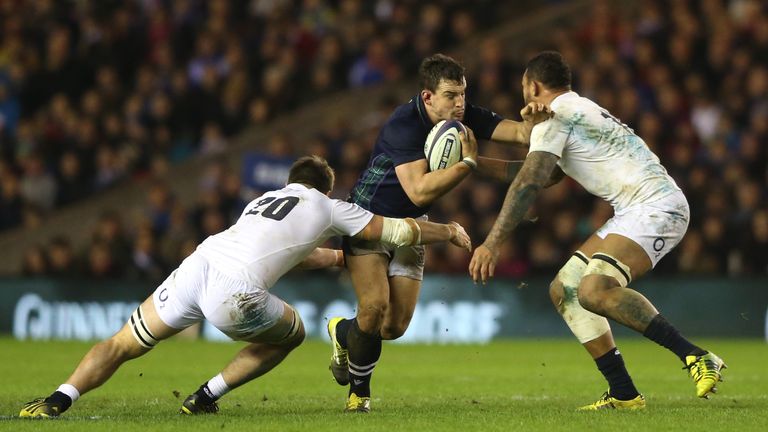 Scotland flanker John Hardie is tackled by Jack Clifford and Courtney Lawes of England