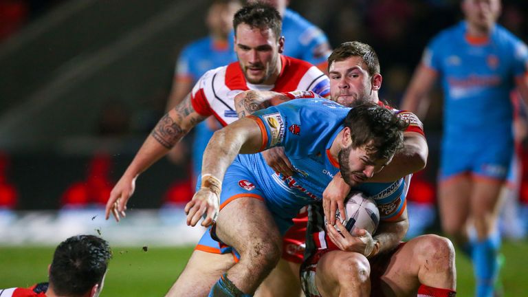 St Helens' Alex Walmsley breaks the Salford defence to score a try