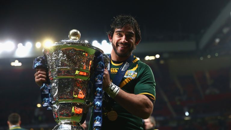 Johnathan Thurston holds the World Cup after Australia's final victory over New Zealand in 2013