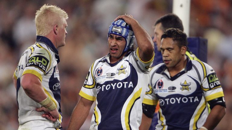 Johnathan Thurston of the Cowboys stands dejected after conceding a try during North Queensland Cowboys' 2005 NRL Grand Final defeat to Wests Tigers