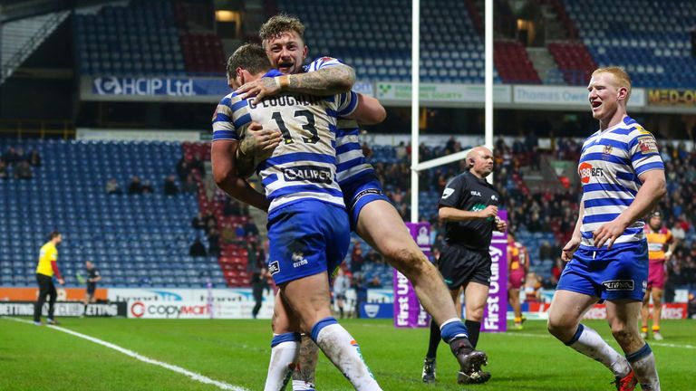 Wigan's Josh Charnley celebrates his late try against Huddersfield with Sean O'Loughlin