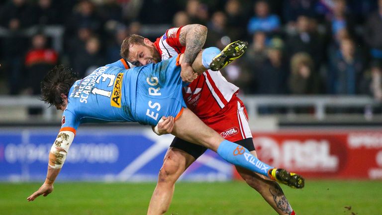 Salford's Josh Griffin tackles St Helens' Louie McCarthy-Scarsbrook