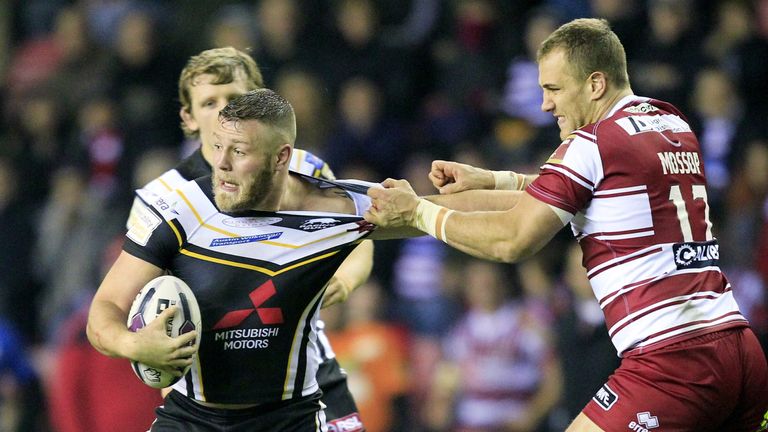 Wigan's Lee Mossop tackles Salford's Josh Jones