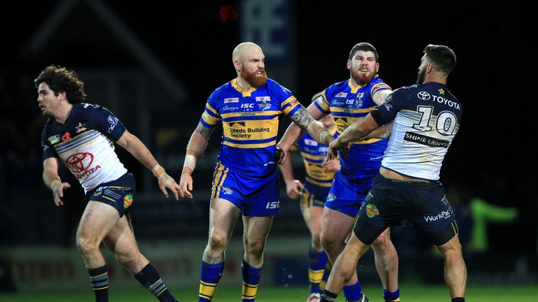 Leeds Rhinos' Mitch Garbutt (second right) punches North Queensland Cowboys James Tamou, resulting in a red card 