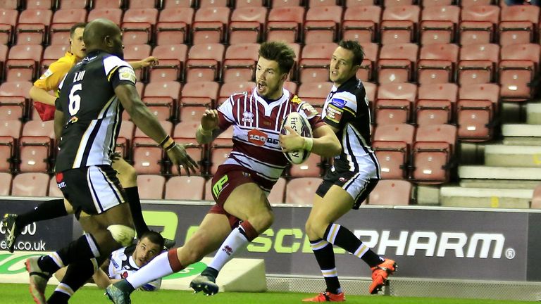 Wigan's Oliver Gildart scores the first of his two first-half tries against Salford