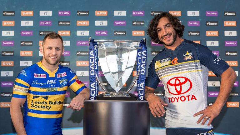 Leeds Rhinos' Rob Burrow (L) and North Queensland Cowboys' Johnathan Thurston (R) pose with the World Club Challenge trophy