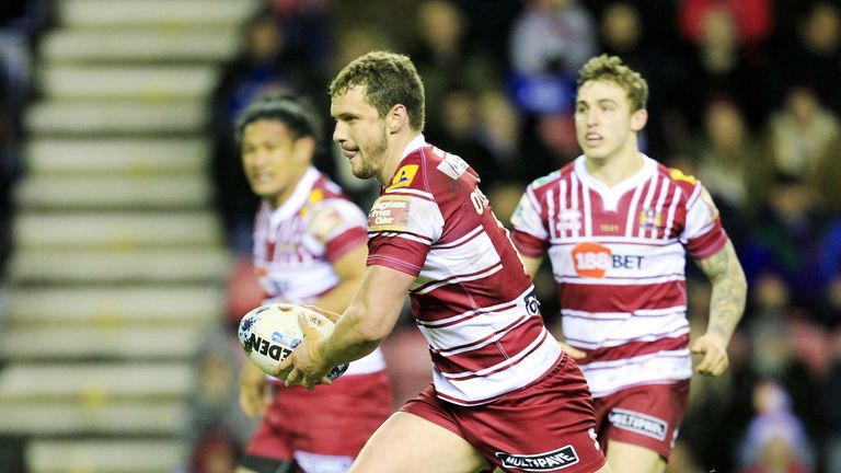 Wigan captain Sean O'Loughlin on the charge against Brisbane