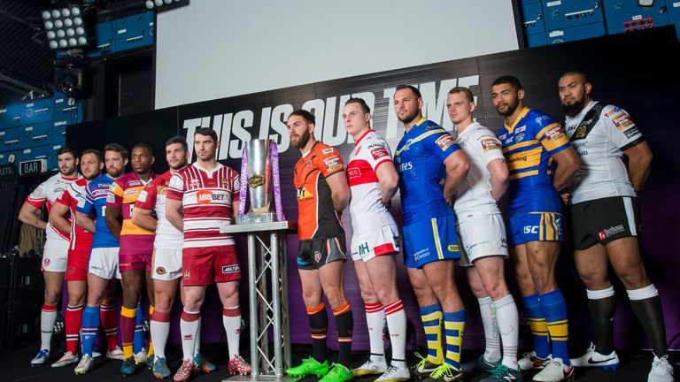Twelve representatives from the Super League clubs pose for for a photo at the 2016 season launch