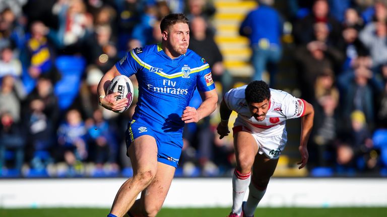 Warrington's Tom Lineham breaks past Hull KR's Kieran Dixon